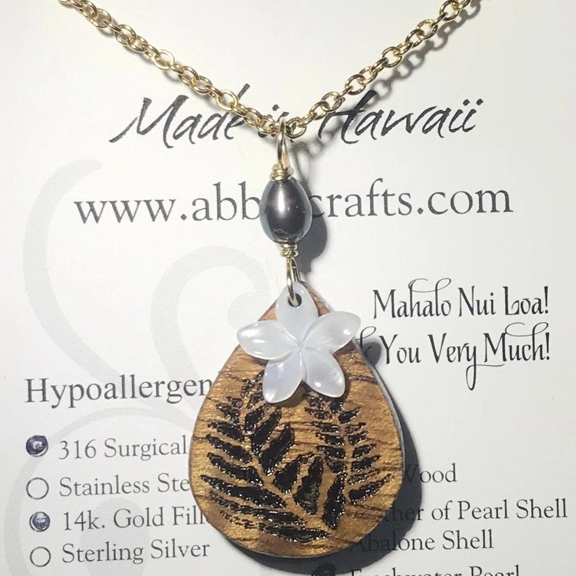 Koa Wood Teardrop Shaped Fern Engraved Pendant with Plumeria