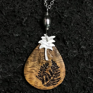 Koa Wood Teardrop Shaped Fern Engraved Pendant with Palm Tree Shaped Carved Shell Pendant and Dark Pearl Necklace