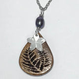 Koa Wood Teardrop Shaped Fern Engraved Pendant with Plumeria Flower Shaped Carved Shell Pendant and Dark Pearl Necklace